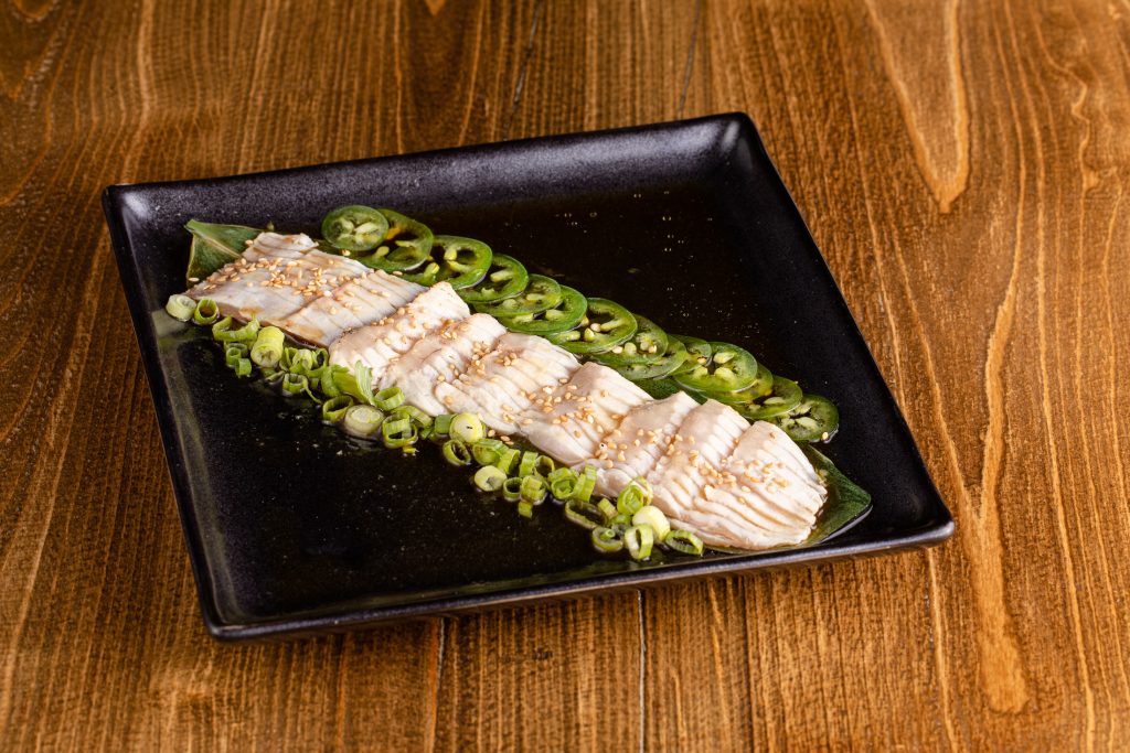 Lightly seared, buttery albacore tuna toro, topped with thinly sliced jalapeños, gluten-free ponzu, green onion and sesame seeds