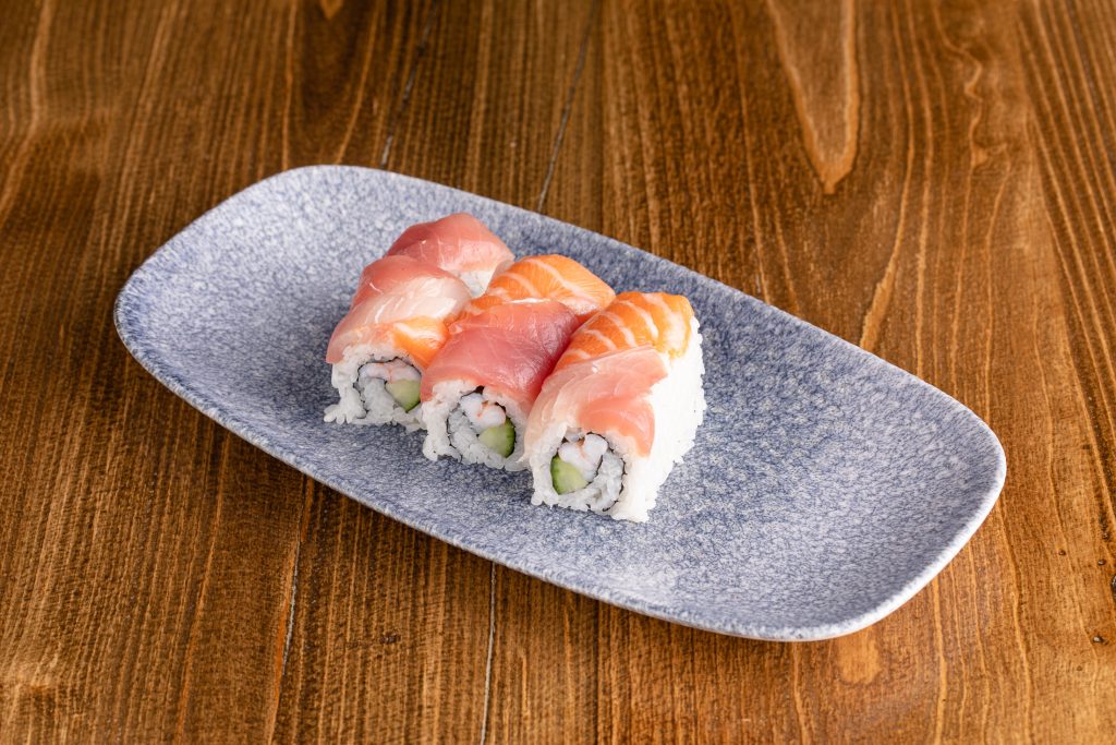 Ebi and cucumber inside, topped with fresh salmon, tuna, and yellowtail