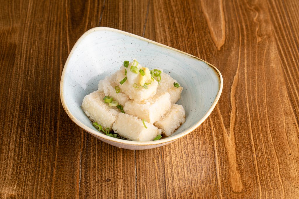Lightly fried tofu with clear dashi broth, grated ginger, grated radish