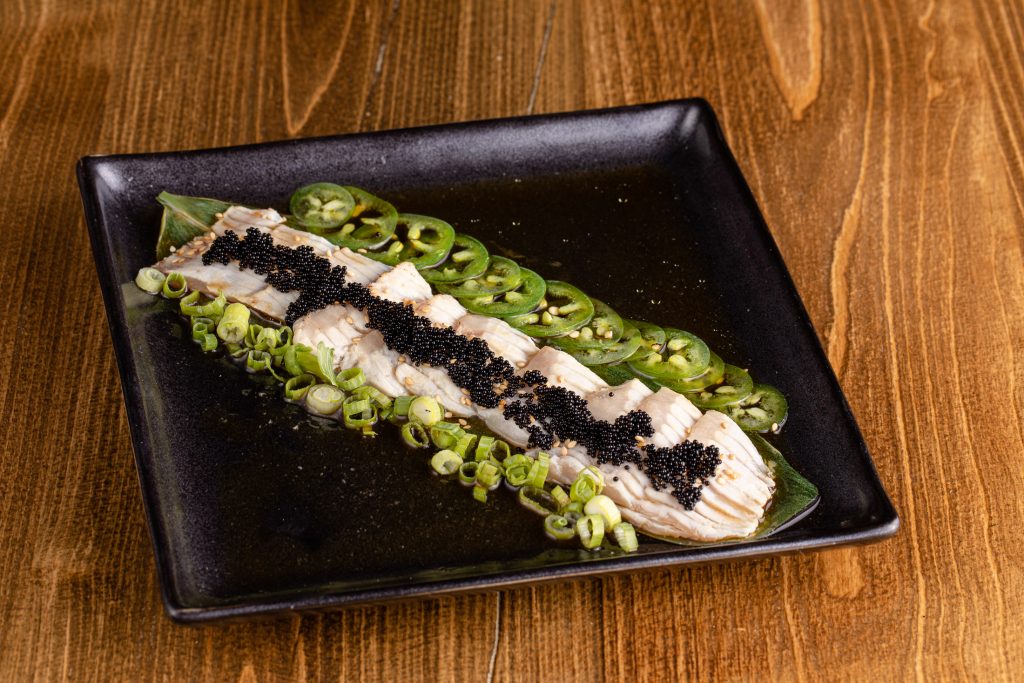 Albacore tuna toro seared with olive oil and garlic, tobiko, jalapenos, ponzu, green onion, sesame seeds