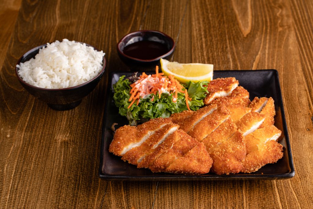 Panko crusted chicken cutlets, tonkatsu sauce, a salad and white rice