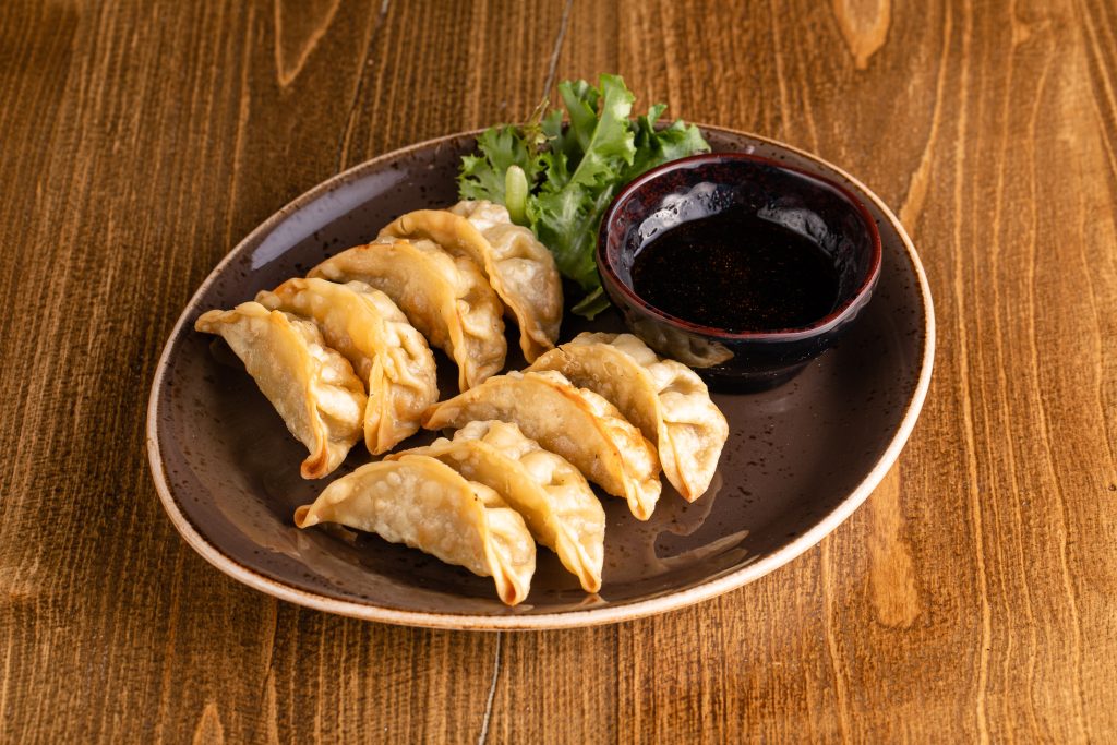 Choice of crispy or pan-seared pork and chicken potstickers