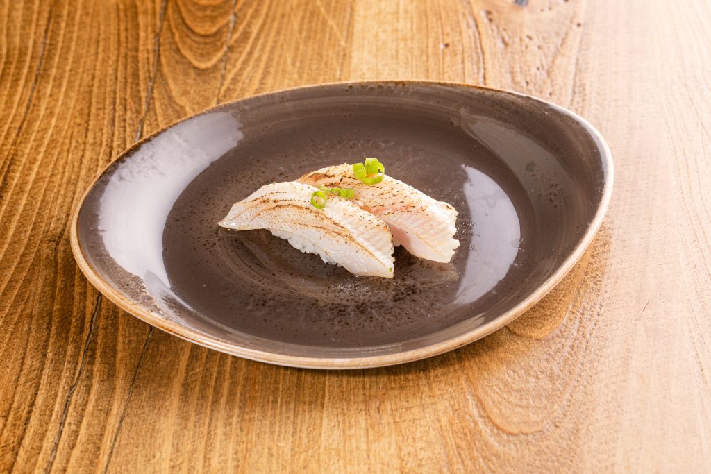 two Yellowtail torched, yuzu shio, ponzu, onion nigiri