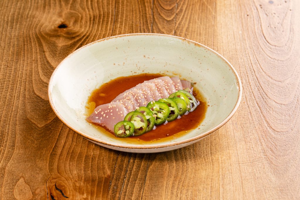 Thinly sliced albacore tuna, citrus soy dressing, jalapenos, sesame seeds