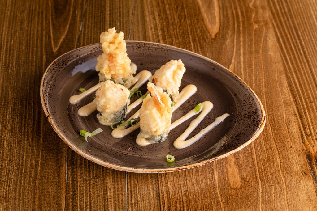 Crab mix stuffed shrimp tempura with creamy house sauce with green onion
