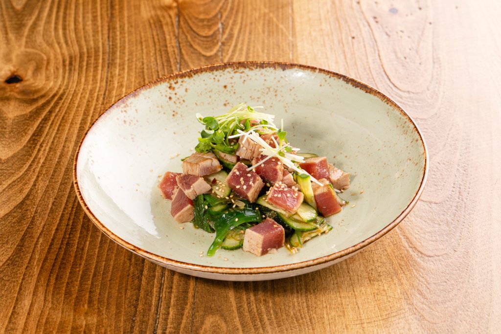 Marinated sesame seaweed, lightly seared tuna, cucumbers, white onion, sesame-soy dressing