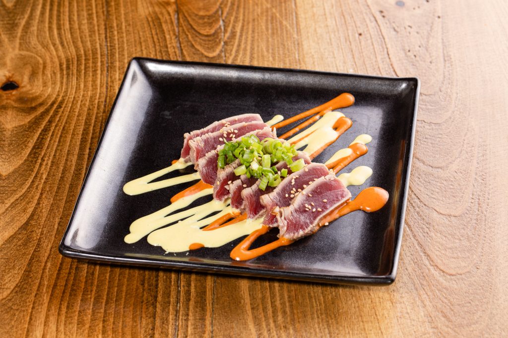 Lightly seared raw tuna, Mikuni original dream sauces, green onion, sesame seeds