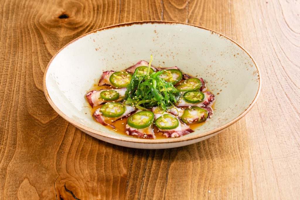 Thinly sliced octopus, seaweed salad, citrus soy dressing, jalapenos, sesame seeds