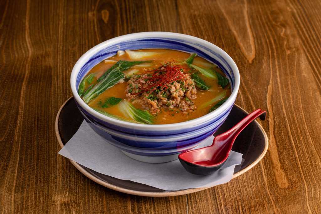 Spicy sesame broth with spicy ground pork, steamed bok choy, chopped chives