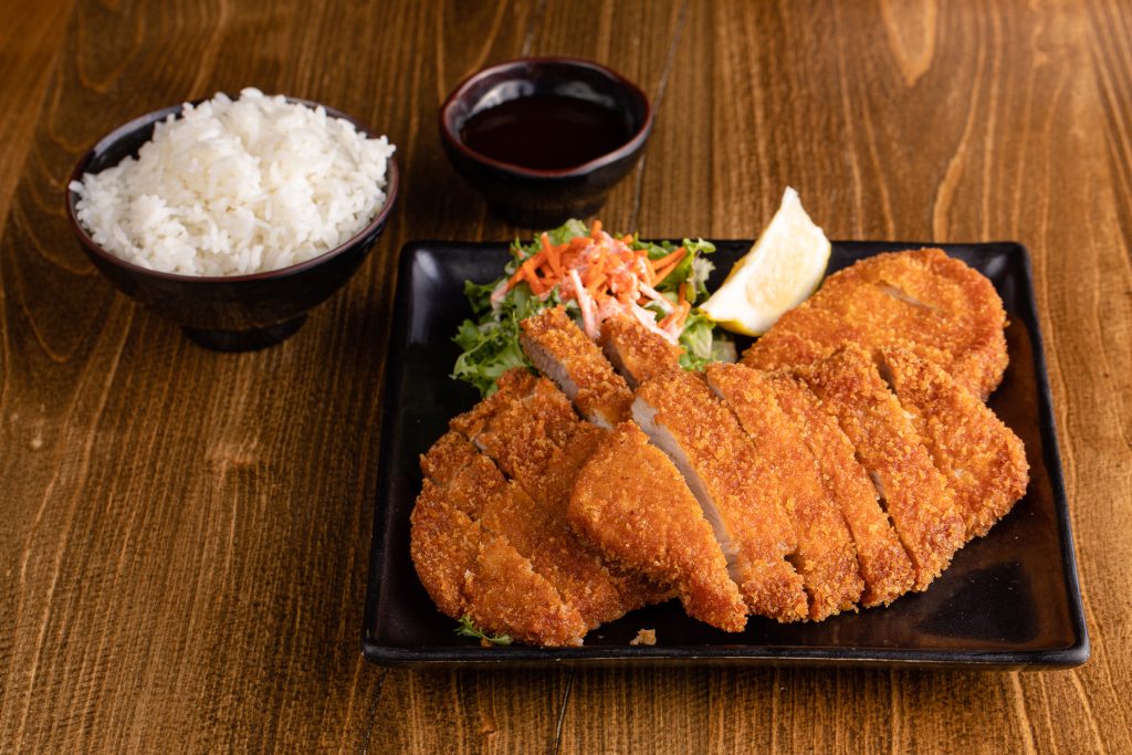 Panko crusted kurobuta pork cutlets, tonkatsu sauce, a salad and white rice