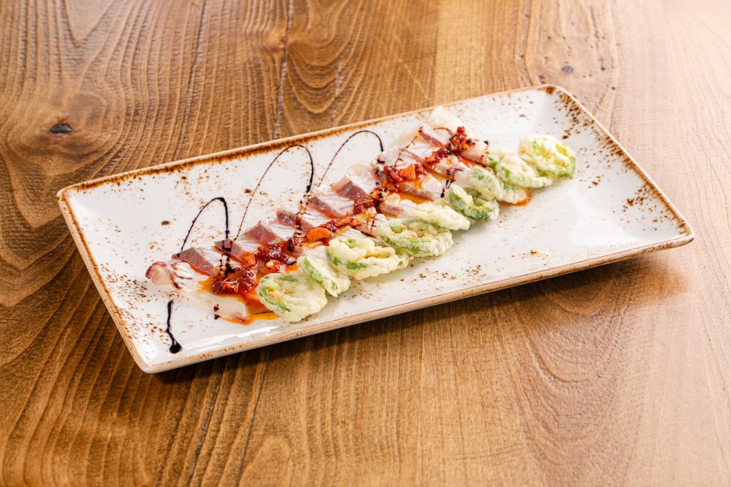 Seared white fish, chili garlic almond sauce, truffle wasabi sauce, tempura jalapenos, balsamic