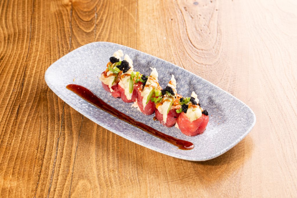 Tuna wrapped spicy crab mix, chopped asparagus tempura, chili-teriyaki, tobiko, green onion, sesame seeds